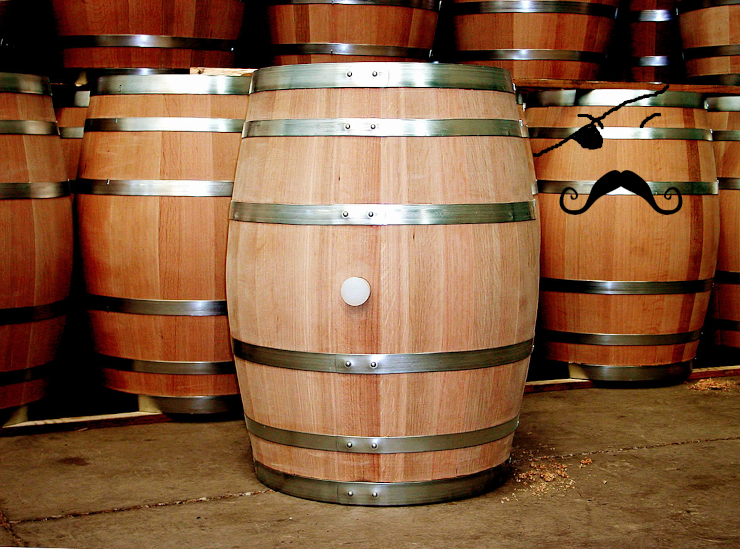 A group of oak barrels, one of which has a curled mustache, an eye patch, and a reddish slat reminiscent of a stereotypical facial scar